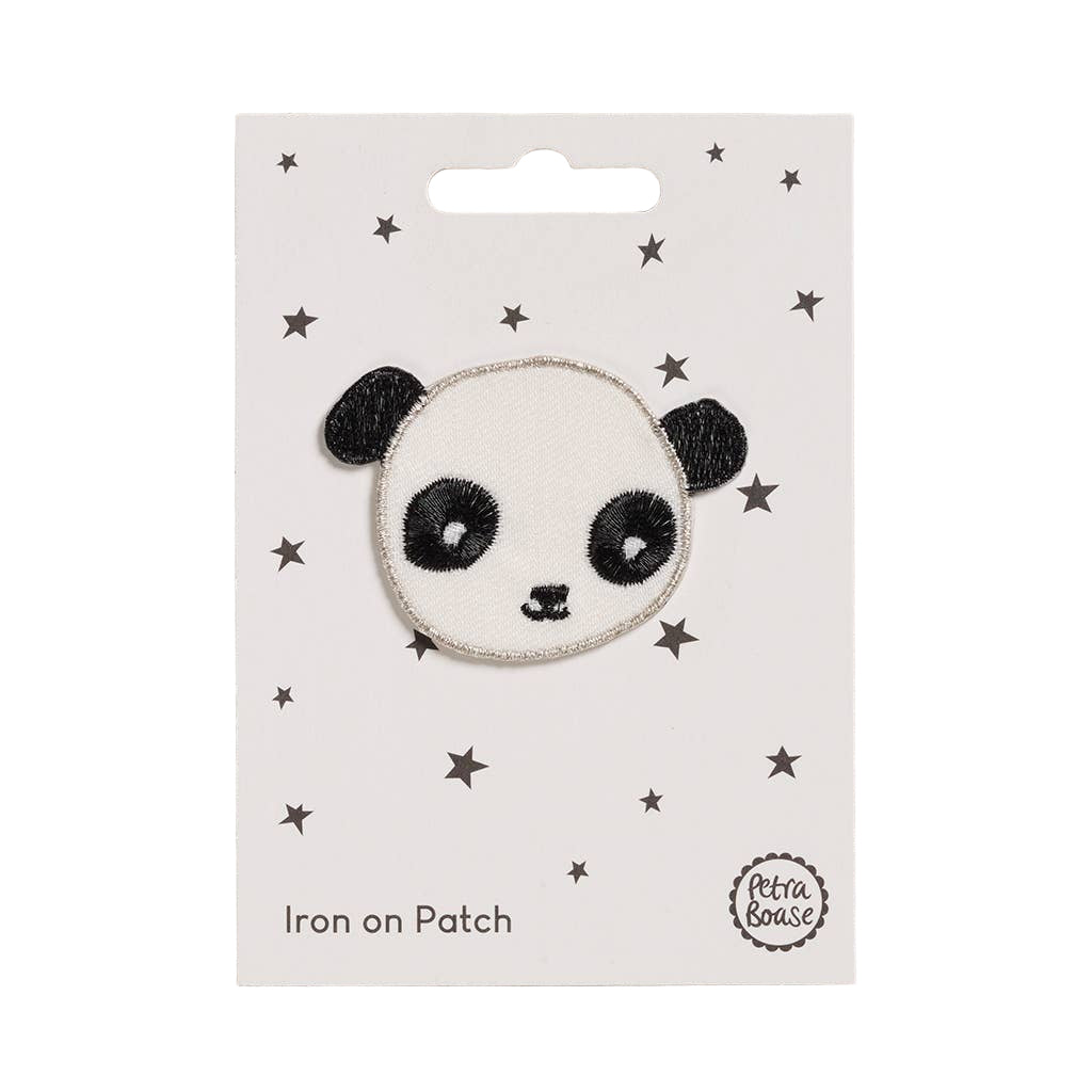 Panda-shaped iron on patch on a white card with star patterns, brand 'Petit & Mignon' visible.